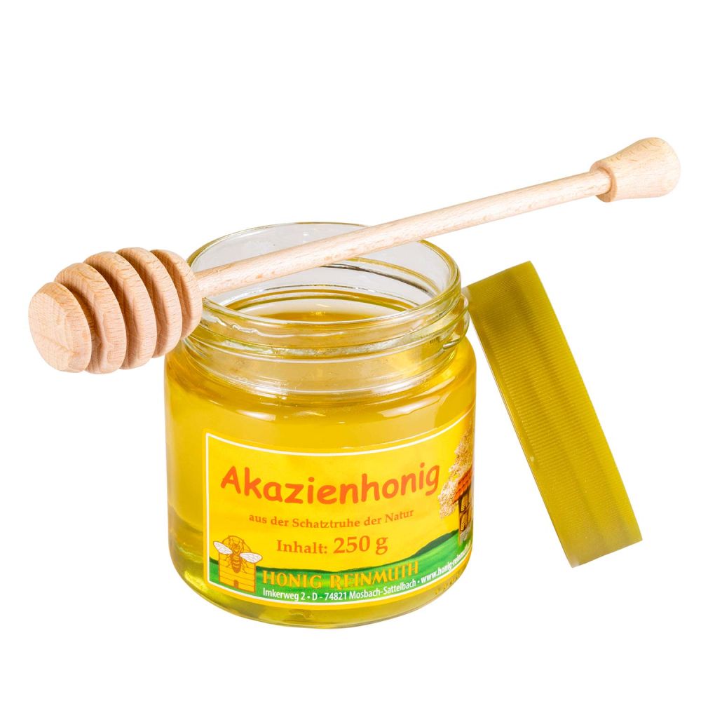 Honiglöffel dekorativ auf Akazienhonig